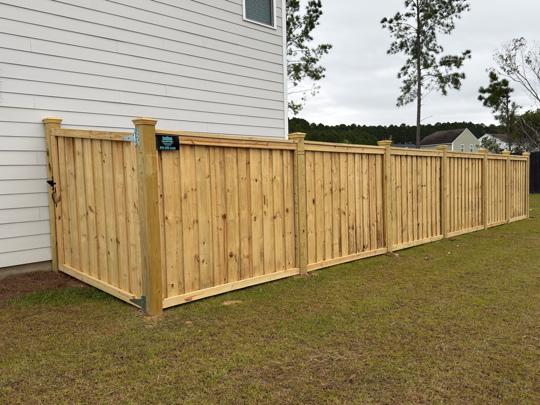 Capped wood privacy fence install, Bluffton