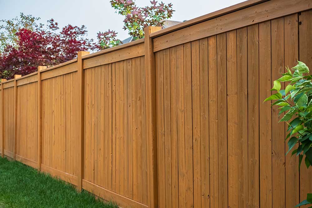 Stained cedar wood privacy fence, style we install